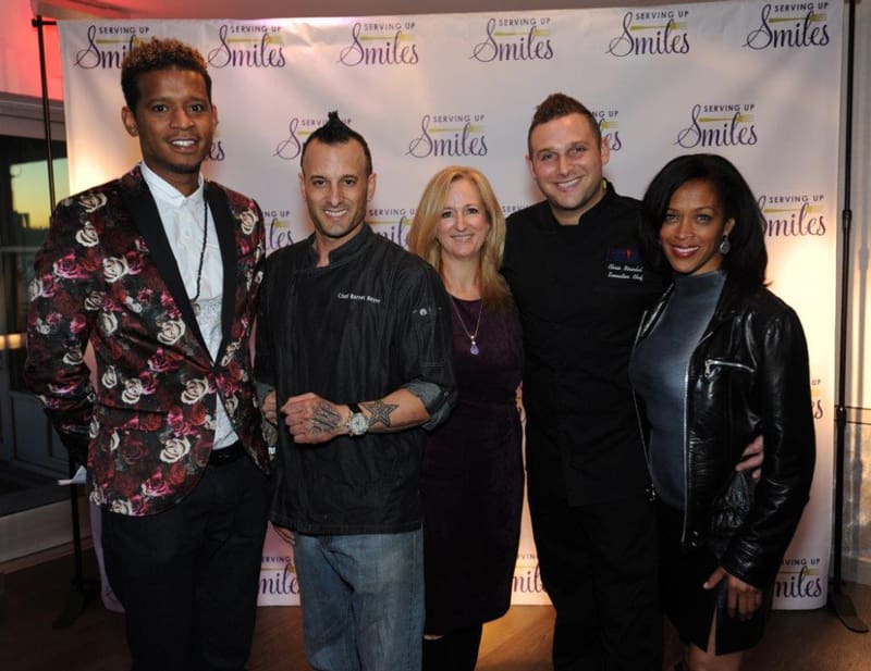 inaugural-serving-up-smiles-tasting-event-with-chef-roble-chef-barret-beyer-giselle-miller-vp-of-events-chef-chris-nirschel-and-michele-hall-duncan-executive-director