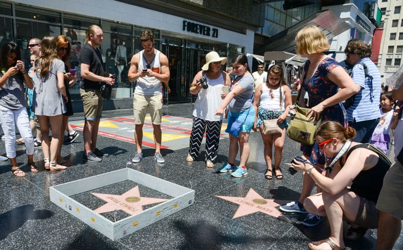 vCurrently residing in Los Angeles, many know him as the artist who built a tiny wall around Trump’s star on the Hollywood walk of fame.